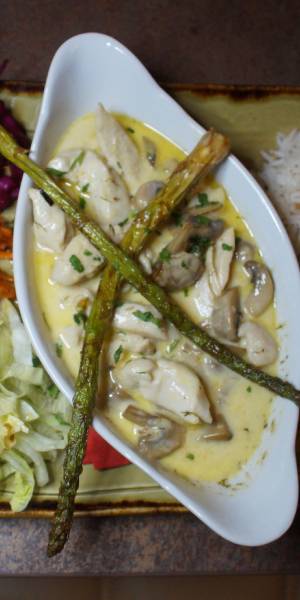 Creamy Chicken, a Cappadocian dish served at Cappadocia Restaurant, Warrington. It consists of chicken, mushrooms and asparagus in a creamy sauce.